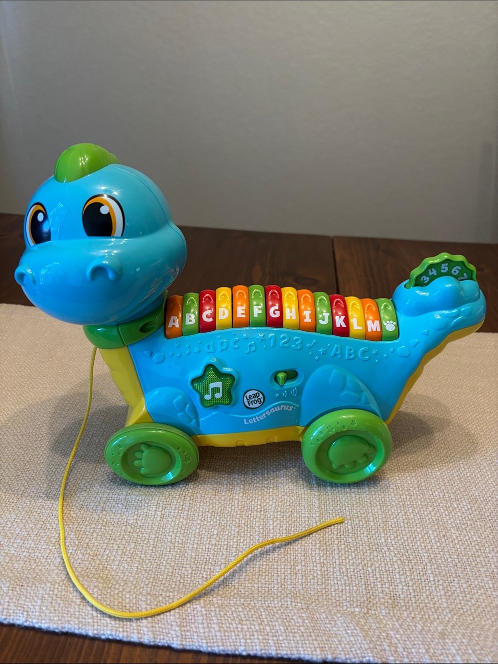 Leap Frog Lettersaurus alphabet pull along toy.
